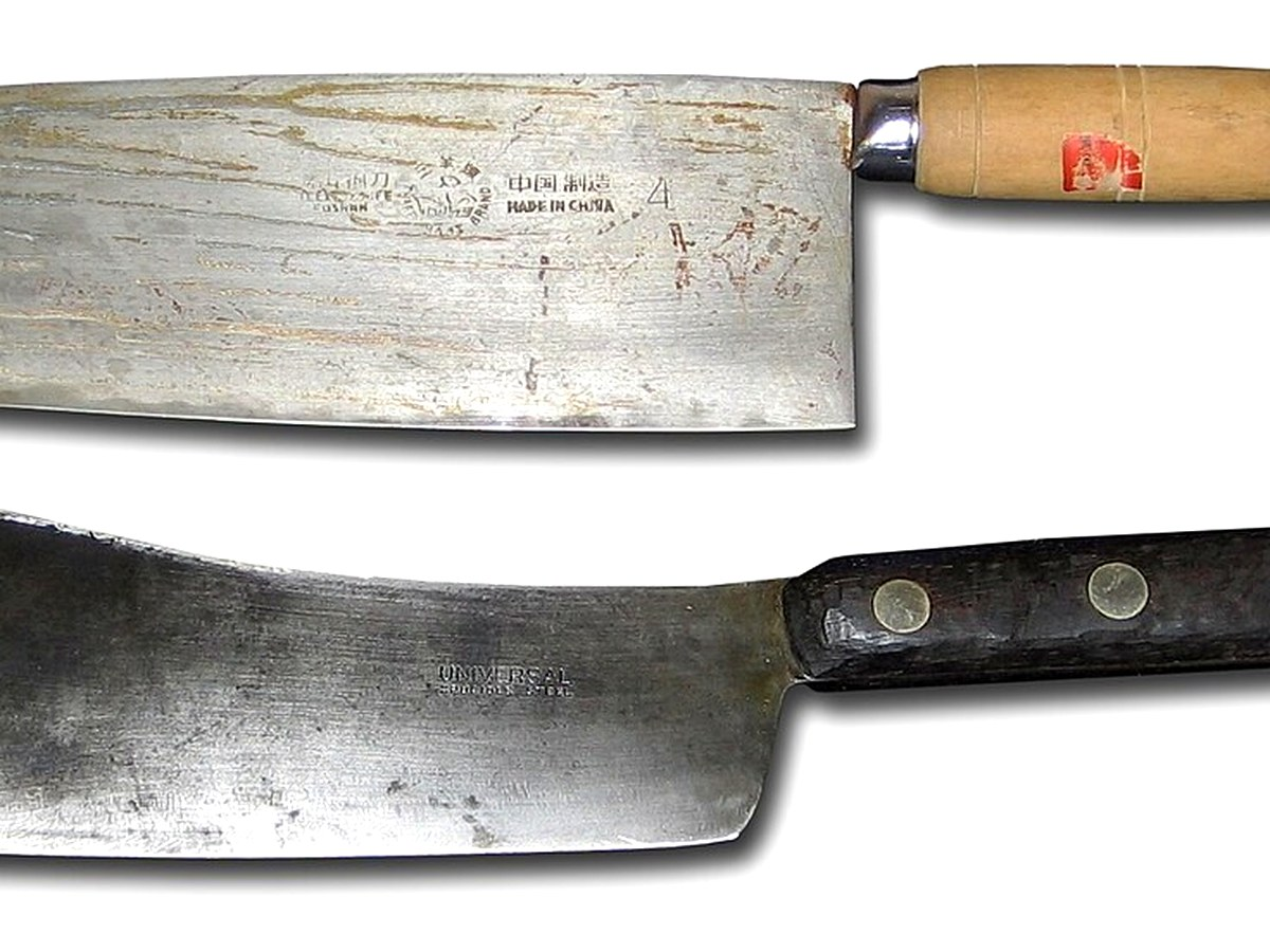 Chinese vegetable cleaver cai dao on a clean cutting board